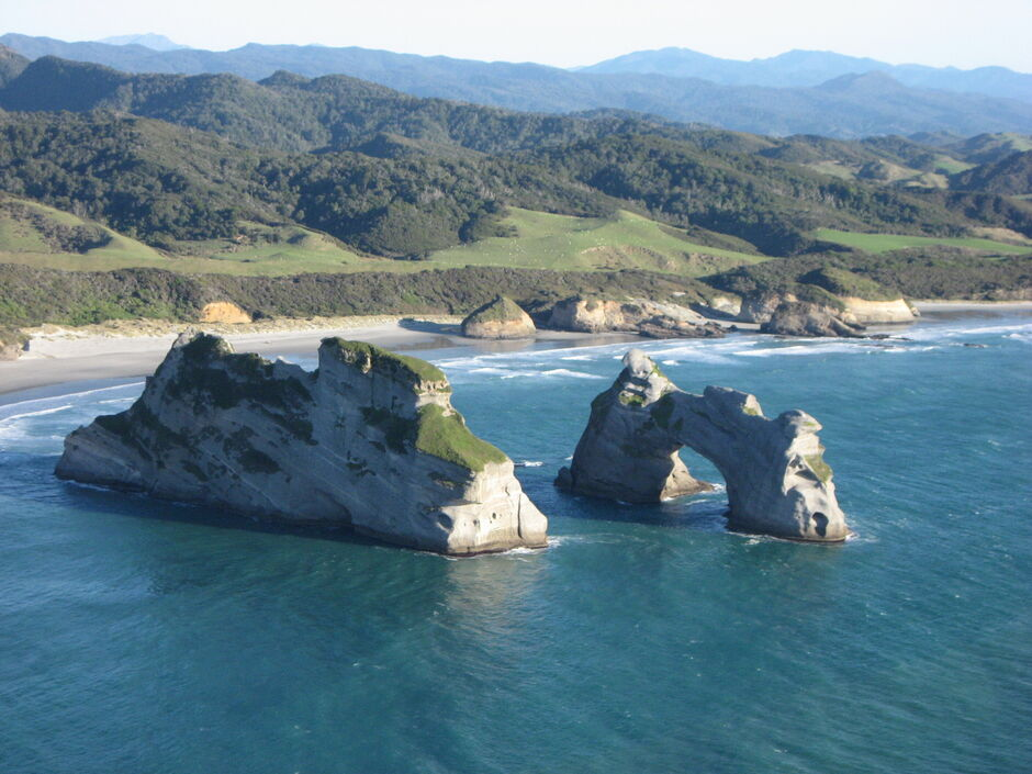 Wharariki-sea-arches-on-the-Golden-Bay-Air-West-Coast-scenic-flight.png