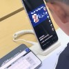 手机店内小孩哥用通缉令上证件号认证游戏 官方提醒：不要效仿 可能会被拘留